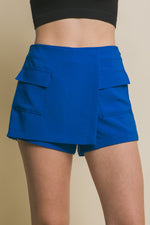 Vibrant blue cargo skorts with functional pockets, showcased against a plain background.