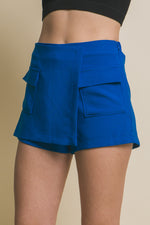 Vibrant blue women's skorts with functional cargo pockets, showcasing a stylish and versatile design for active lifestyles.