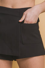 Stylish black women's skorts with functional cargo pockets, showcasing a modern and versatile design.