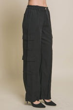 Stylish black cargo pants with multiple pockets, perfect for everyday wear from Cecelia's fashion collection.