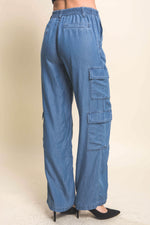 Relaxed-fit denim cargo pants with multiple pockets, perfect for comfortable everyday wear from Cecelia's collection.