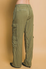 Comfortable cargo pants with multiple pockets, made of soft tencel fabric, in a versatile olive green color.