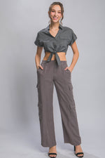 Stylish women's gray cargo pants with pockets, paired with a matching cropped blouse, showcasing a trendy casual outfit from the CCWHOLESALECLOTHING brand.