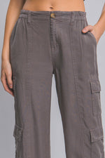 Full-length gray Tencel pants with cargo pockets on the legs, showcased against a plain background.