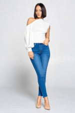 Stylish one-shoulder top with model in blue jeans from CCWHOLESALECLOTHING.