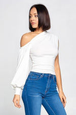 Stylish one-shoulder top with puffed sleeve, showcased on a female model with dark hair against a white background.