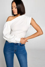 Stylish one-shoulder top in a crisp white shade, complementing the model's sleek, dark hair.