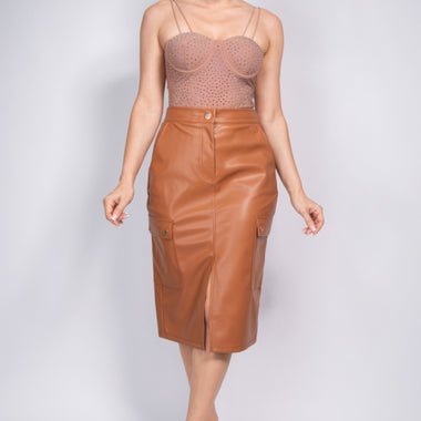 Faux Leather High-rise Cargo Skirt by CCWHOLESALECLOTHING, featuring a chic, sophisticated model wearing the fashionable brown leather midi skirt.