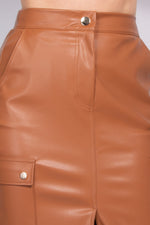 Stylish faux leather cargo skirt with a high-rise waist and sleek metallic button detailing.