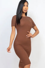 Ribbed bodycon midi dress from Cecelia in a flattering brown tone, showcasing the model's elegant style and feminine silhouette.